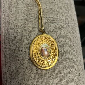 Vintage oval gold tone portrait locket
